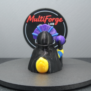Back view of Evil Ducklyn evil sorceress dash duck figurine with flowing black cape, purple staff, and yellow duck body - MultiForge Lab